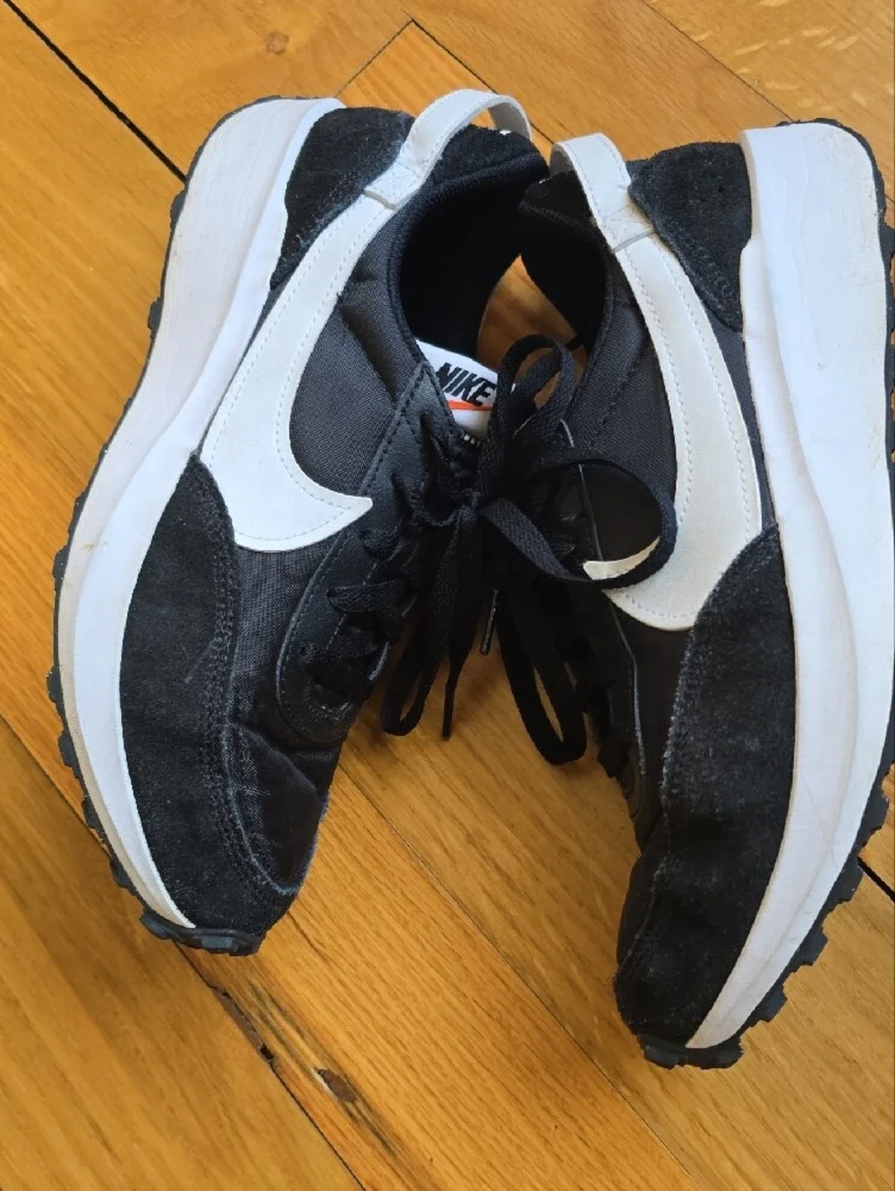 Nike Waffle Debut sneakers featuring a black nylon and suede upper with a white